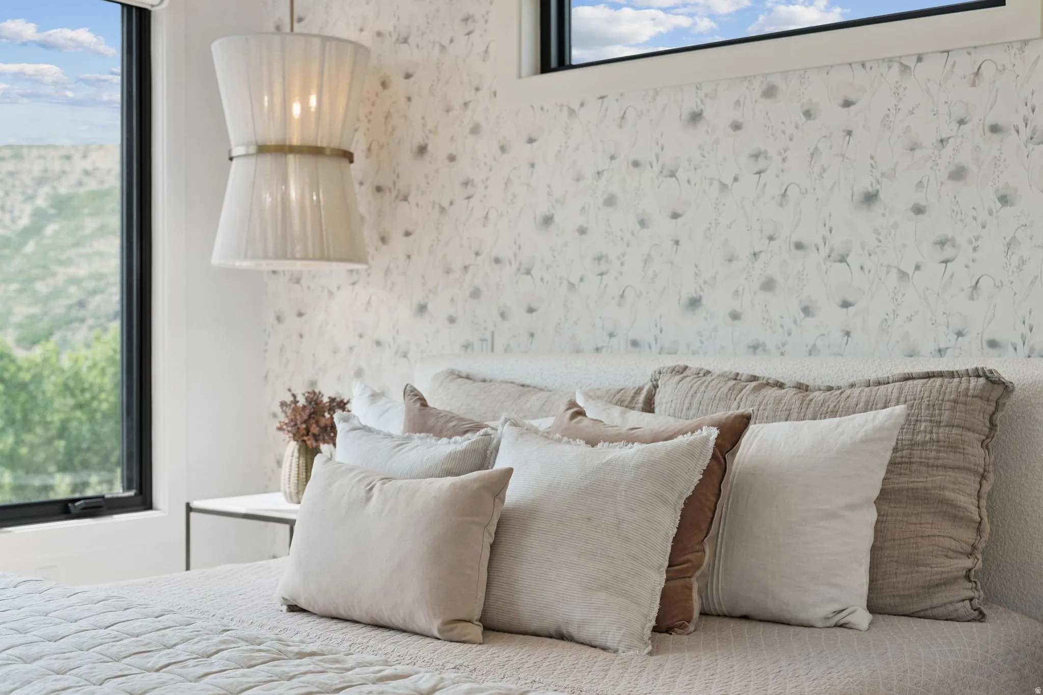 Accent wall featuring floral-patterned wallpaper