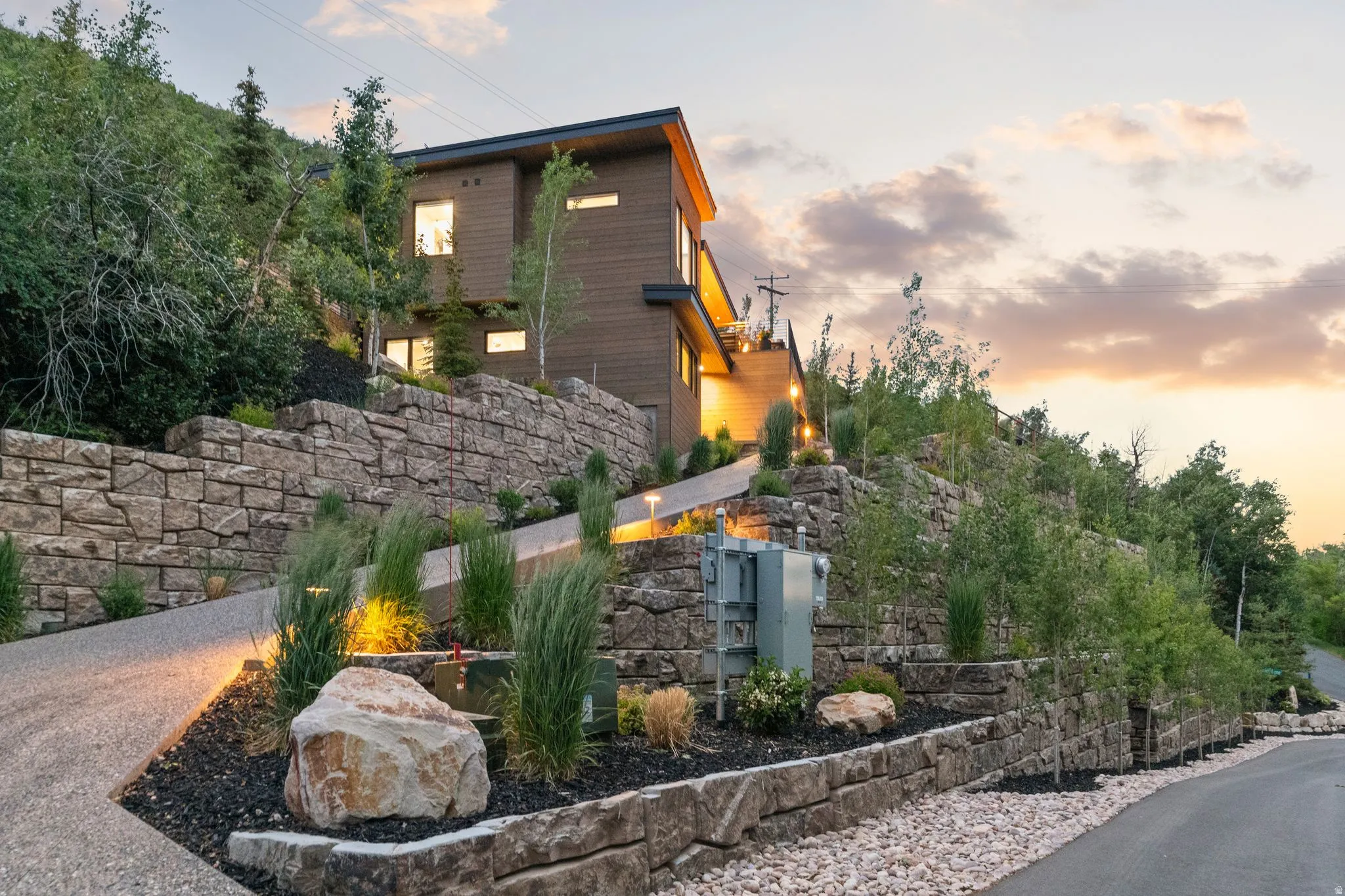 Modern architectural residence featuring a wood-panel exterior and multiple windows