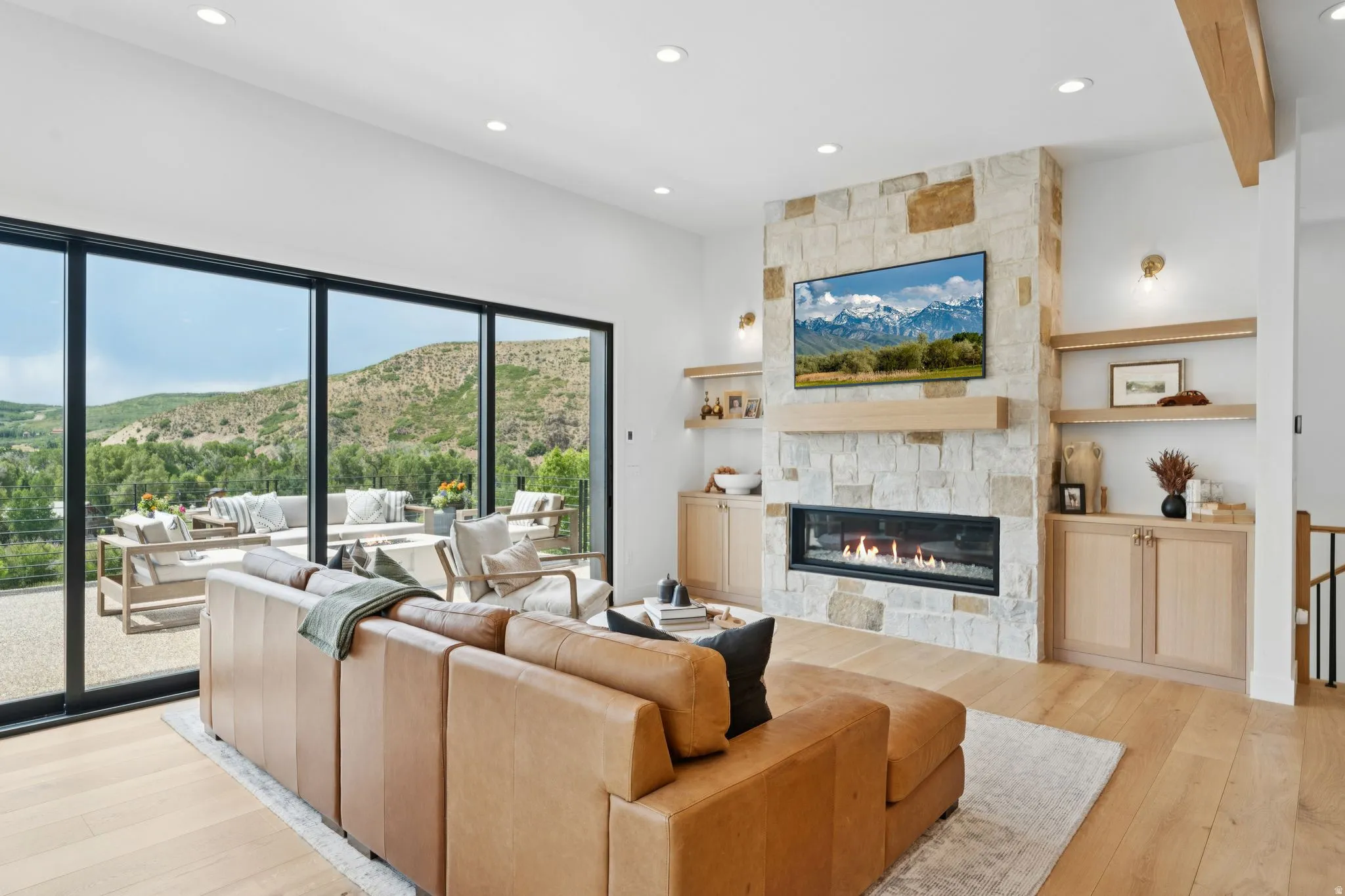 Open-concept living area with wood-finish flooring