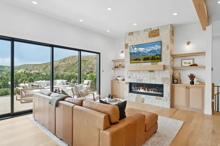 Open-concept living area with wood-finish flooring