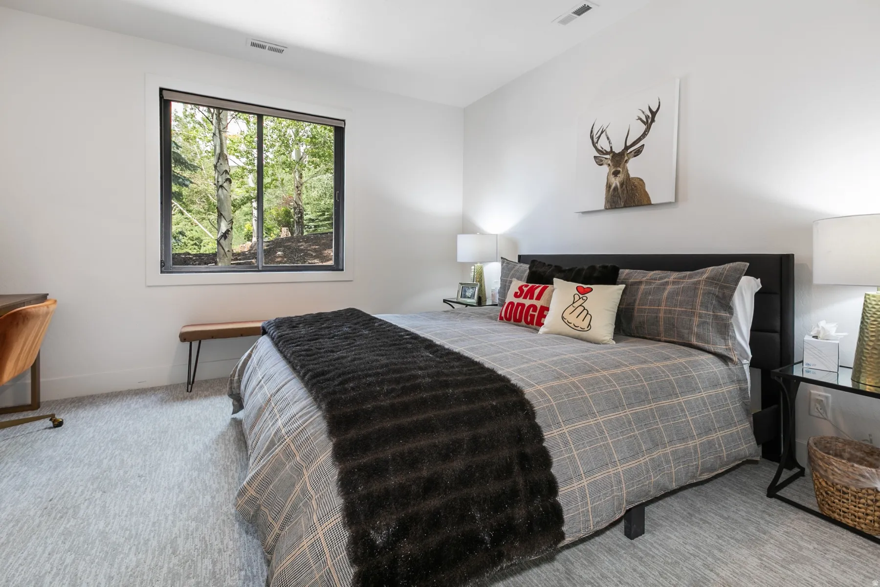 Contemporary bedroom featuring a large window, light gray carpeting, and a built-in ventilation system
