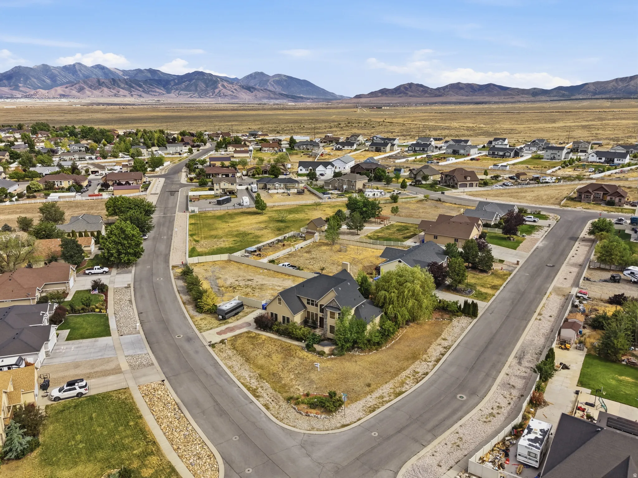 Expansive lot with mountain backdrop, surrounded by established residential properties