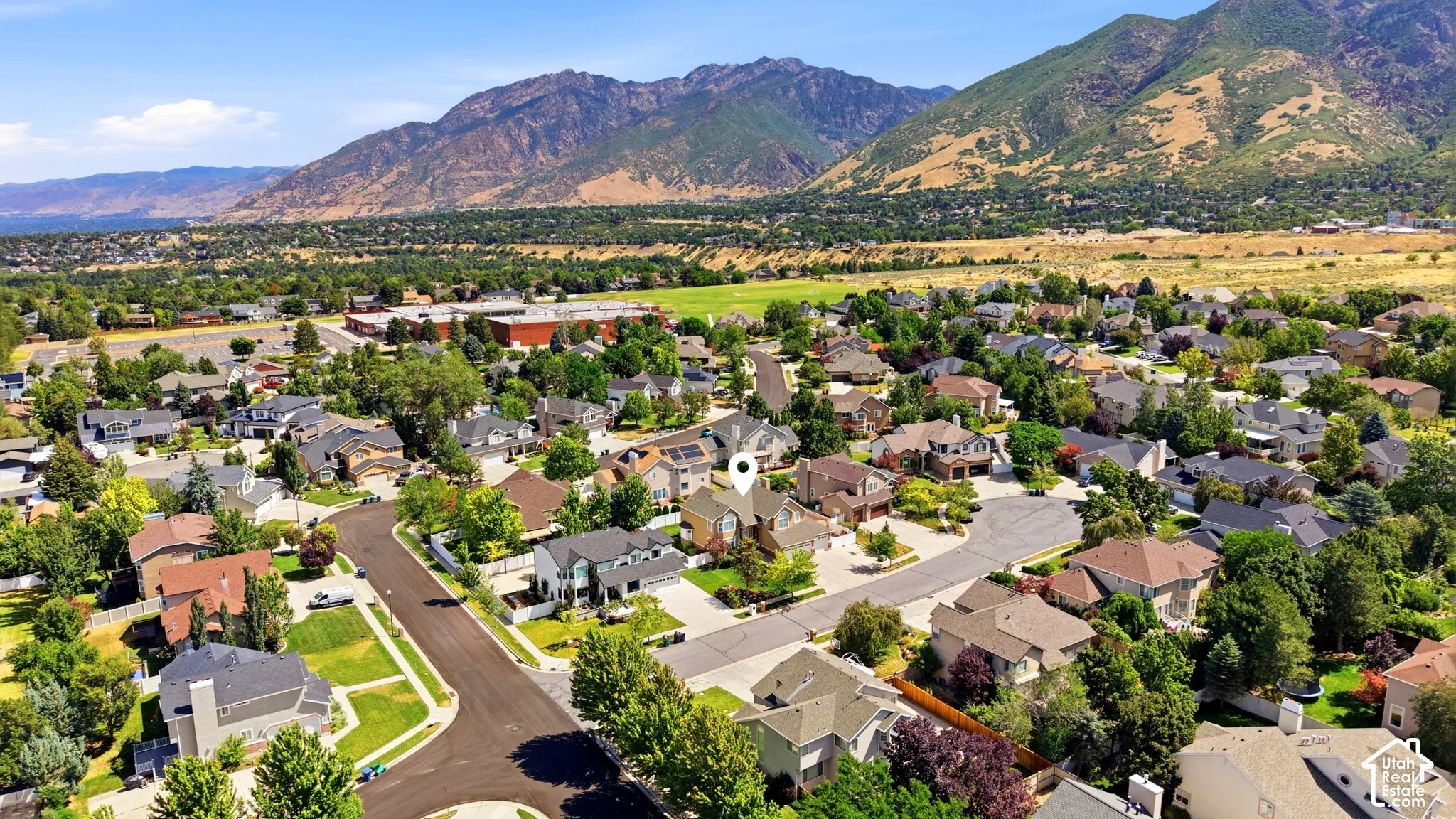 Residential neighborhood featuring varied architectural styles and mature landscaping