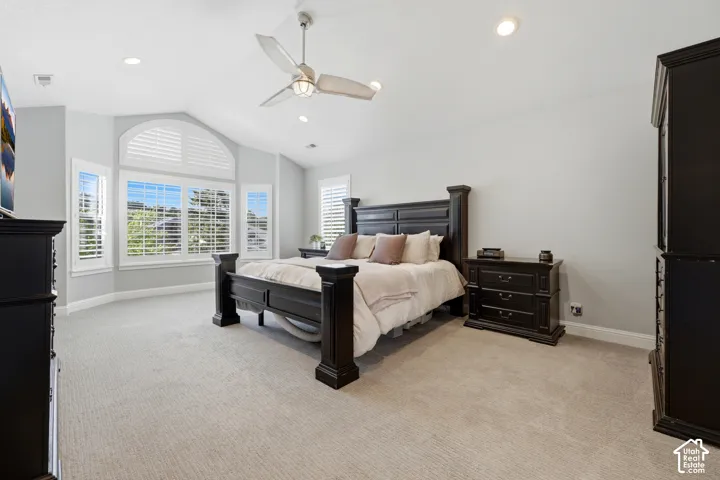 Bay window with plantation shutters and an arched transom window