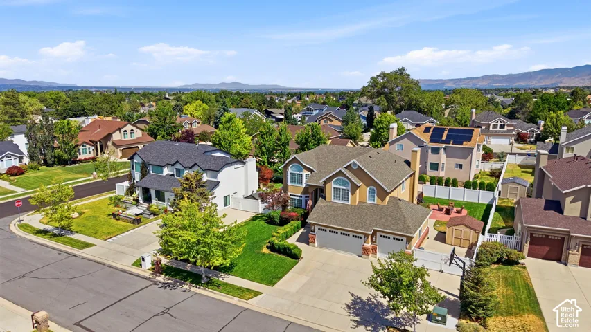 Spacious residential property featuring a stucco exterior, attached two-car garage, and a concrete driveway