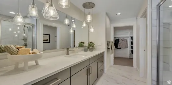 Bathroom featuring a dual vanity with a light-colored countertop and modern .cabinetry. PICTURE IS OF A SIMILAR