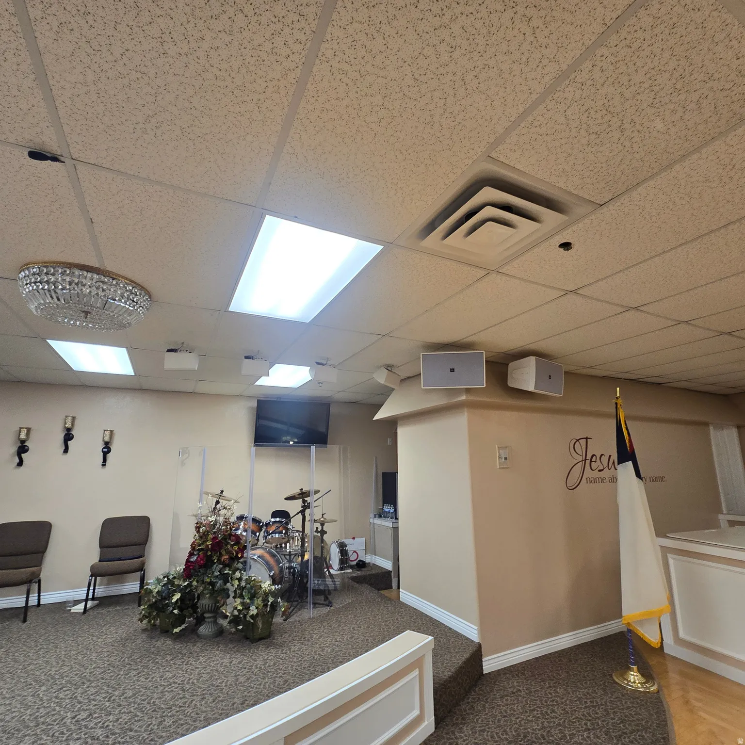 Carpeted flooring extending to a raised platform