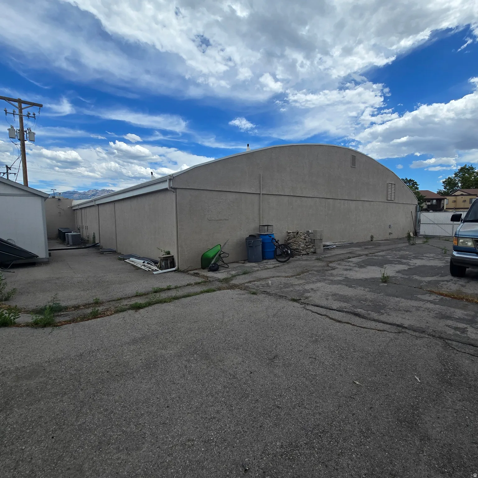 Fenced storage area behind building