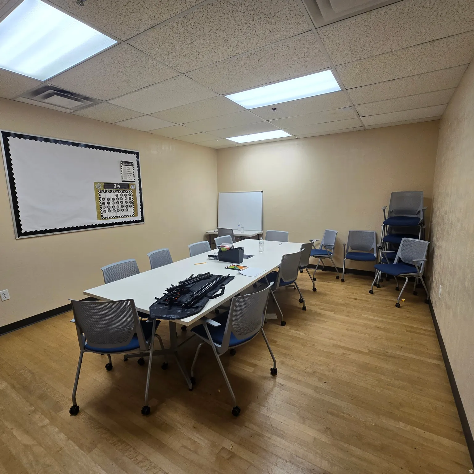 Conference room featuring wood-finish flooring and neutral-toned walls