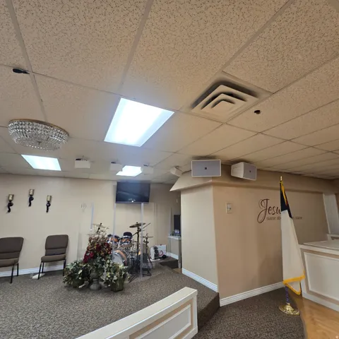 Carpeted flooring extending to a raised platform