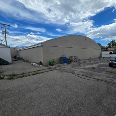 Fenced storage area behind building
