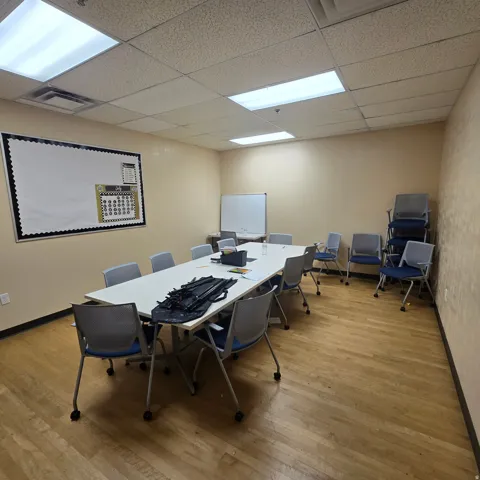 Conference room featuring wood-finish flooring and neutral-toned walls