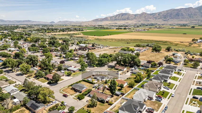 Aerial perspective showcasing a residential neighborhood with a mix of established homes and newer construction