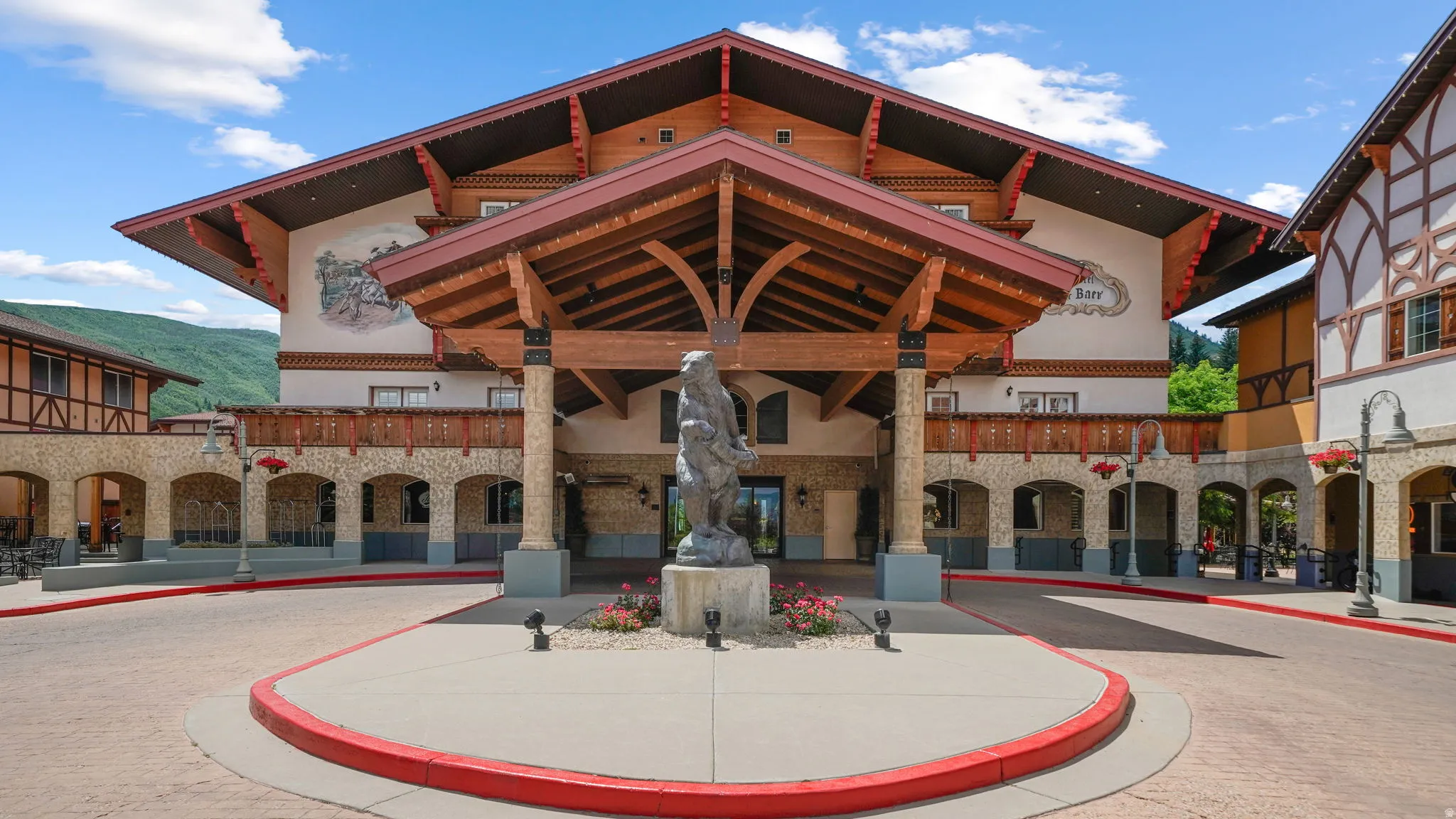 Gabled rooflines and timber frame detailing define this architectural facade