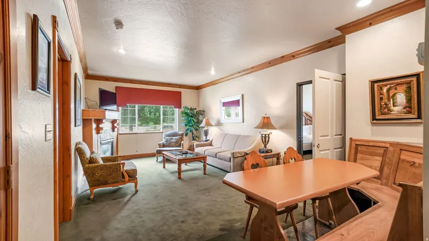Spacious interior room featuring wood trim accents and recessed lighting