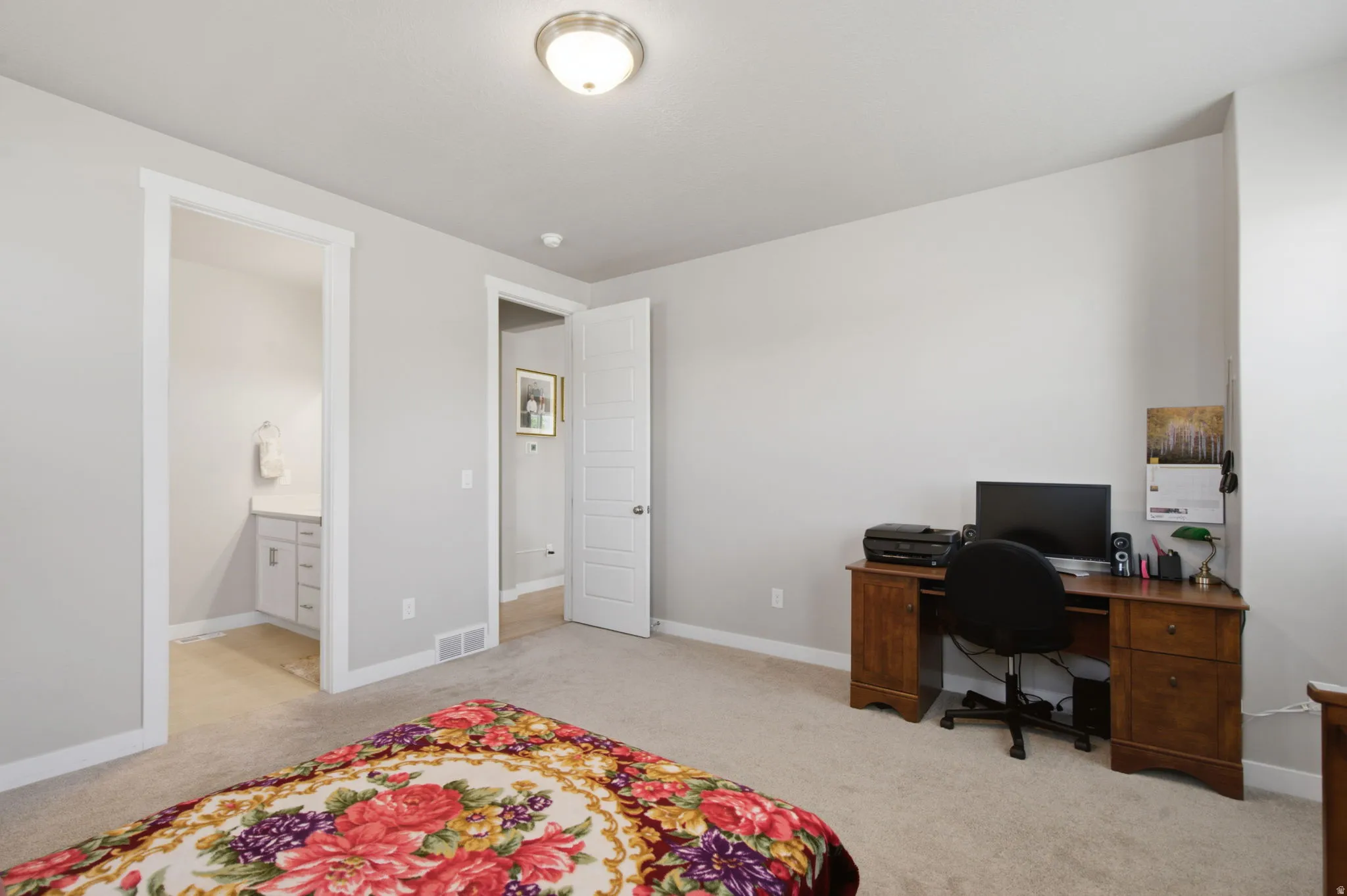 Carpeted room with light gray walls and white trim