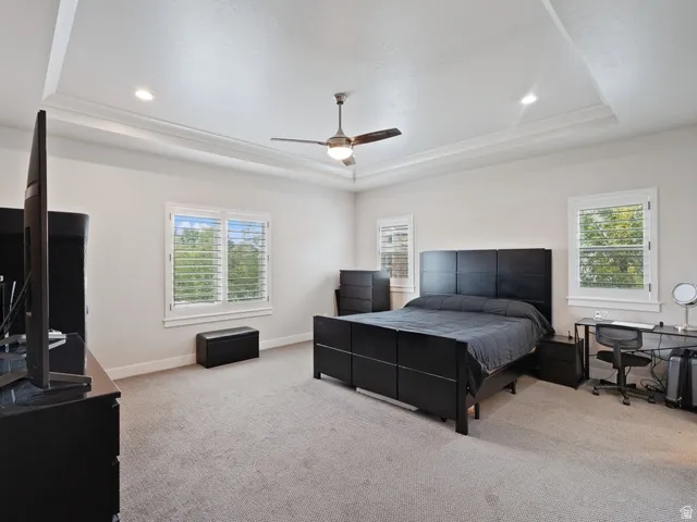 Tray ceiling with recessed lighting and crown molding
