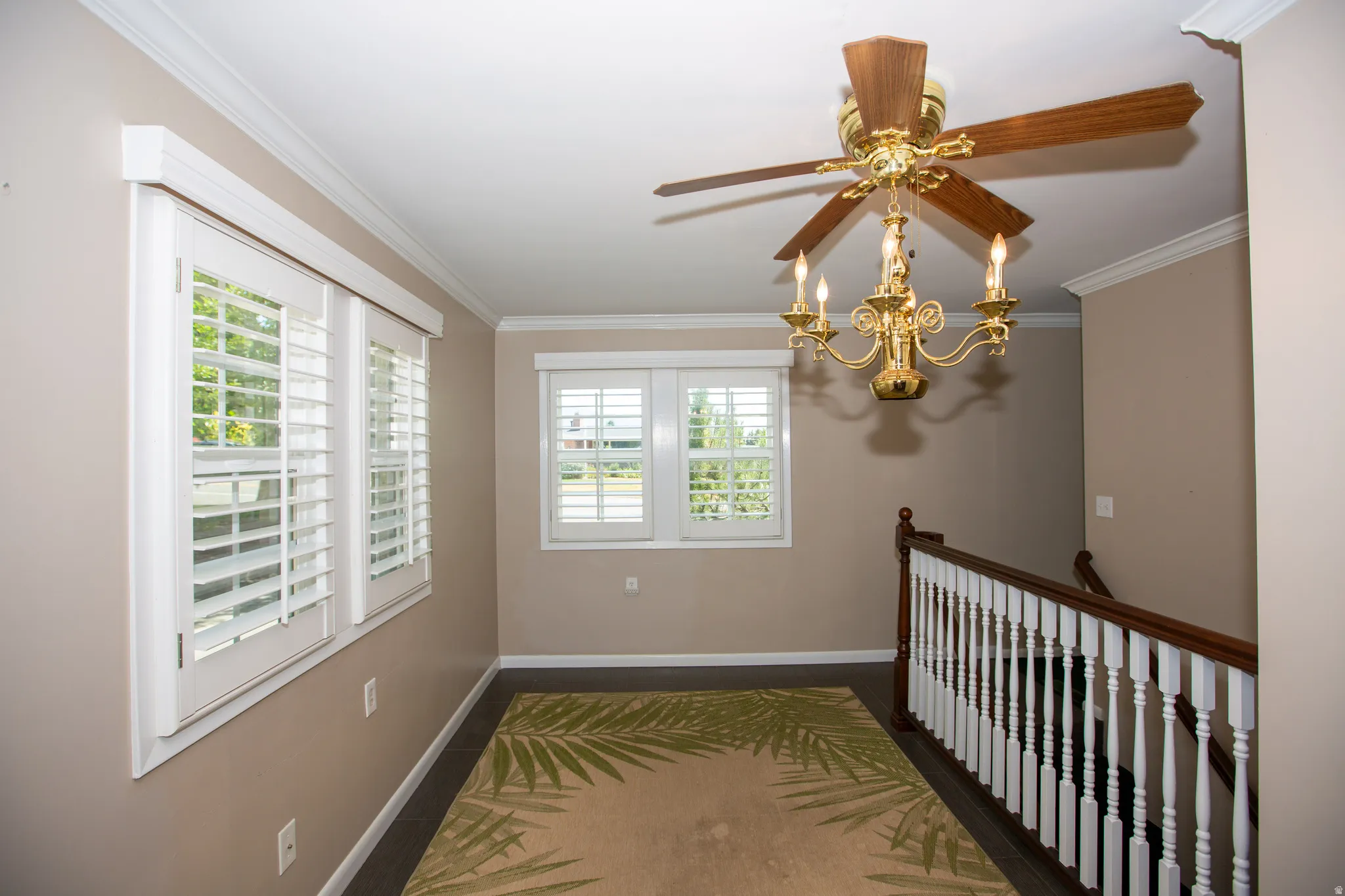 Breakfast area with ceiling fan and plantation shutters