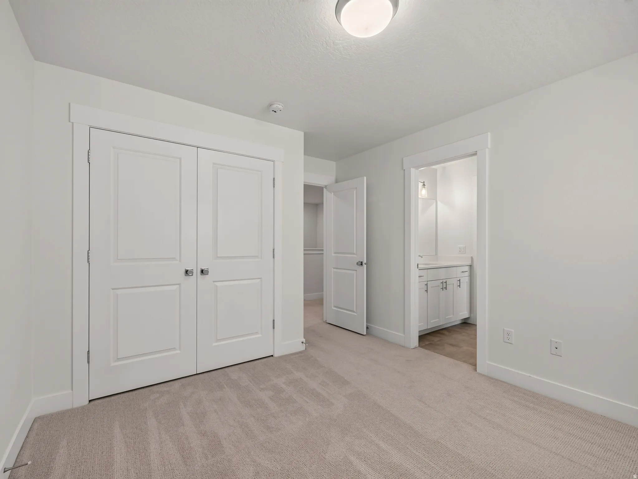 Neutral-toned carpeting throughout