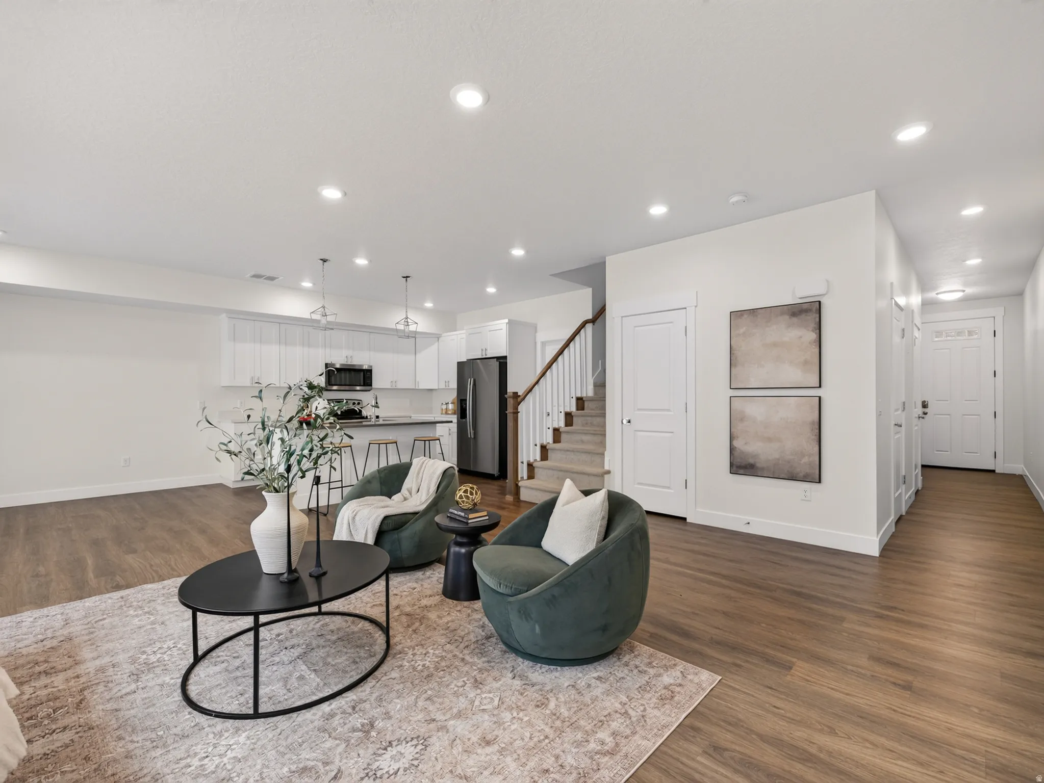 Hardwood LVP throughout main level of home.