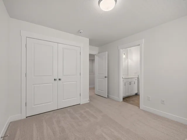Neutral-toned carpeting throughout