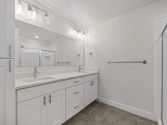 Master bathroom with double sinks.