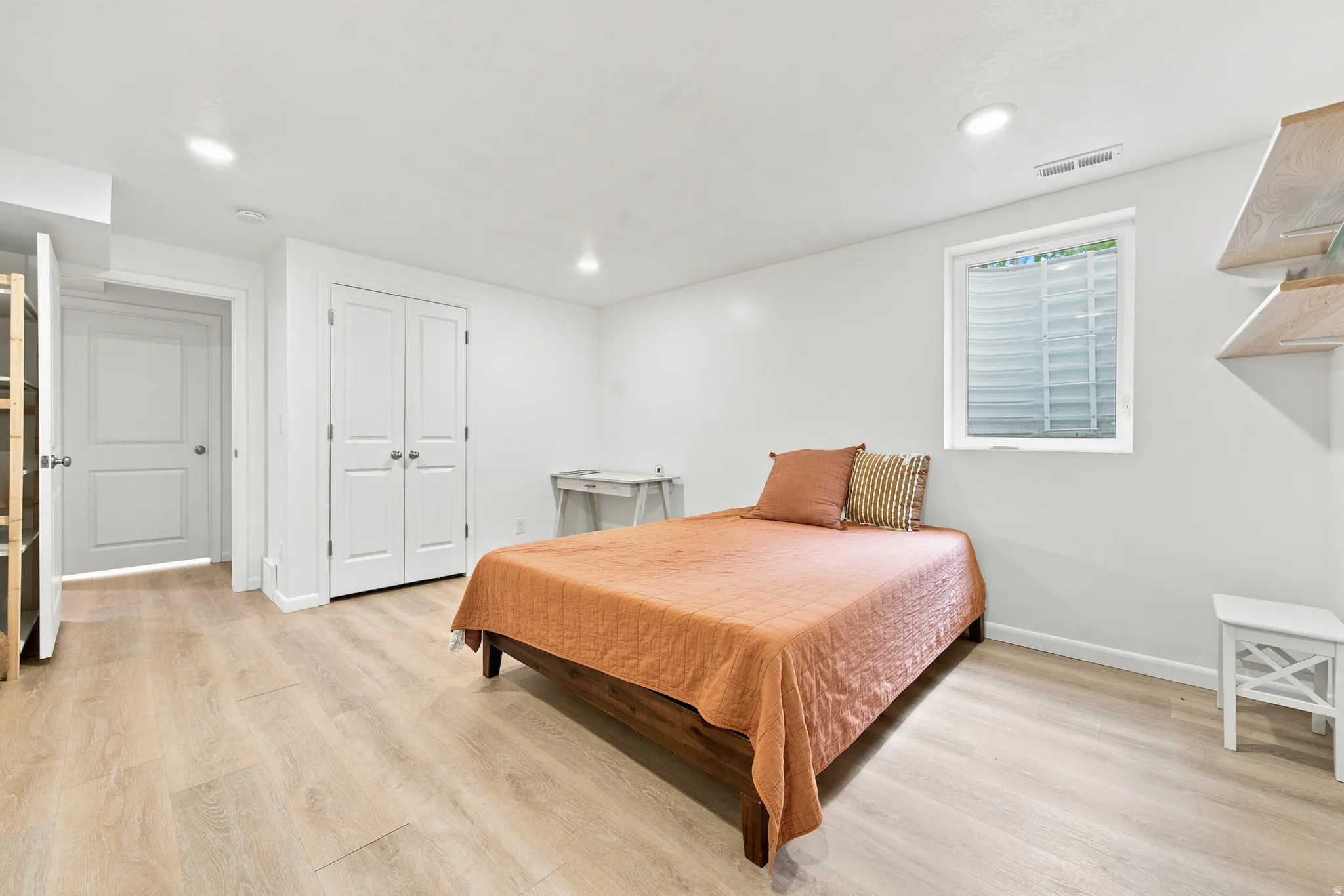 Bedroom featuring light wood-finish flooring and recessed lighting