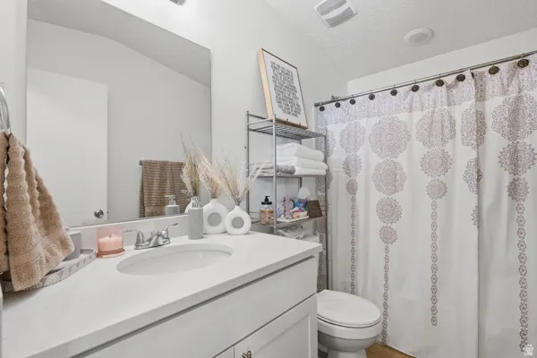 Contemporary bathroom featuring a vanity with an integrated sink and light-colored countertop