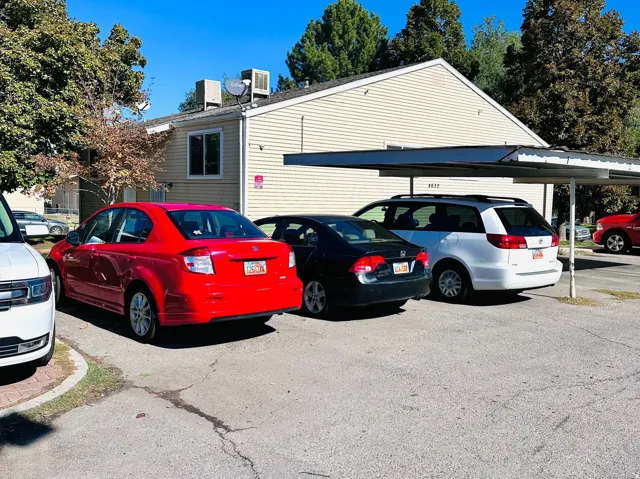 Exterior building featuring horizontal siding and a carport