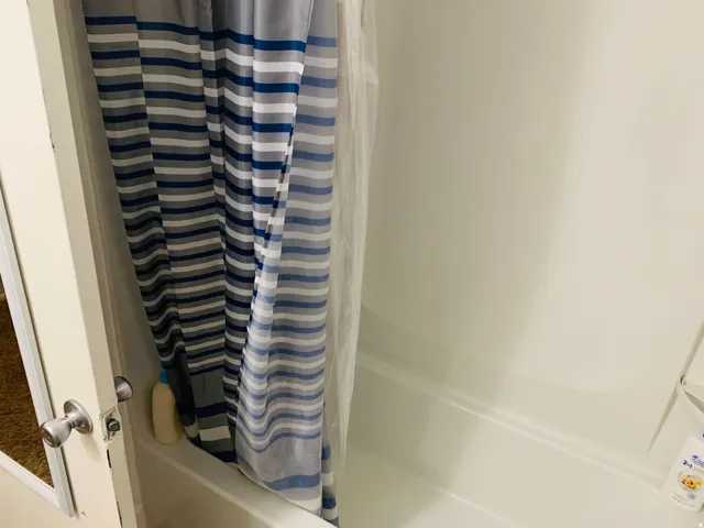White fiberglass tub-shower combination