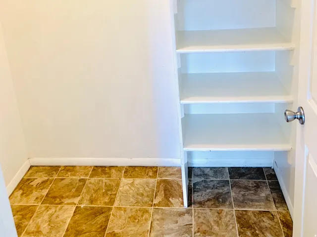 Built-in shelving unit with four levels of storage