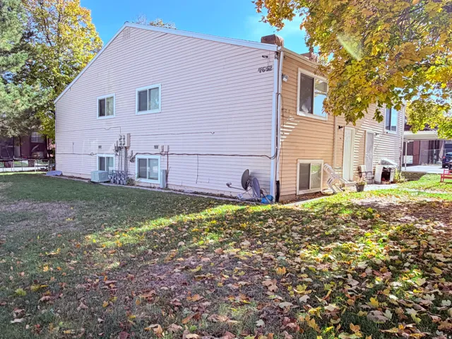 Multi-level exterior with light-colored siding