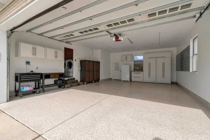 Cleanest garage you'll ever see! Epoxy floors, brand new built in shelves and organizers and super cool lighting!