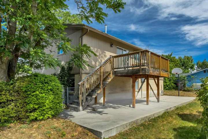 Raised wood deck with full balustrade and staircase