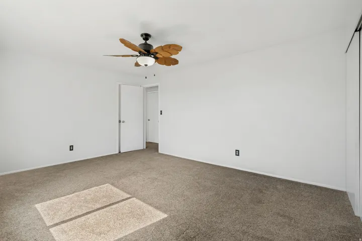 Neutral-toned carpeting paired with white walls
