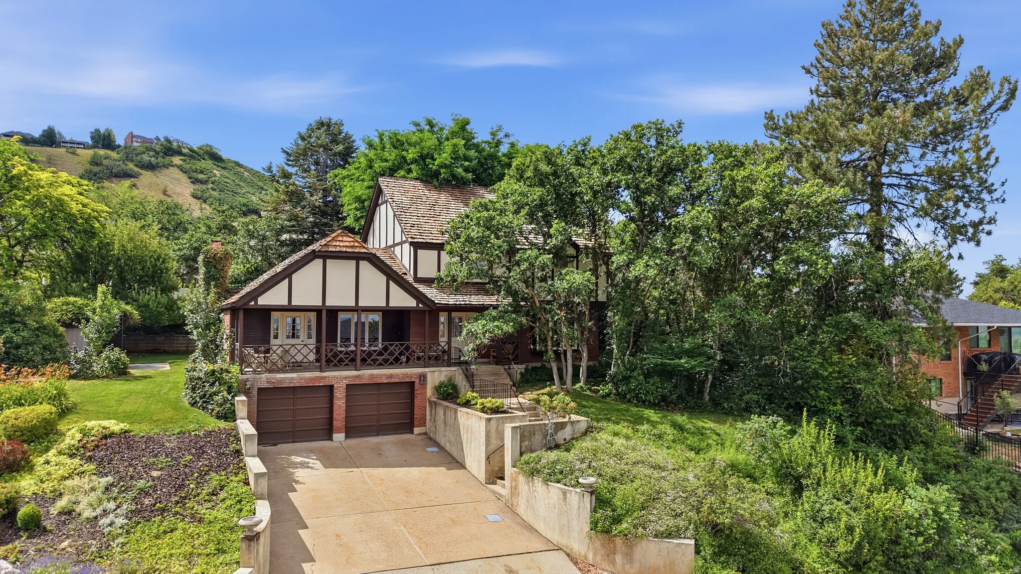 Tudor-style exterior with wood-frame detailing and a shingle roof