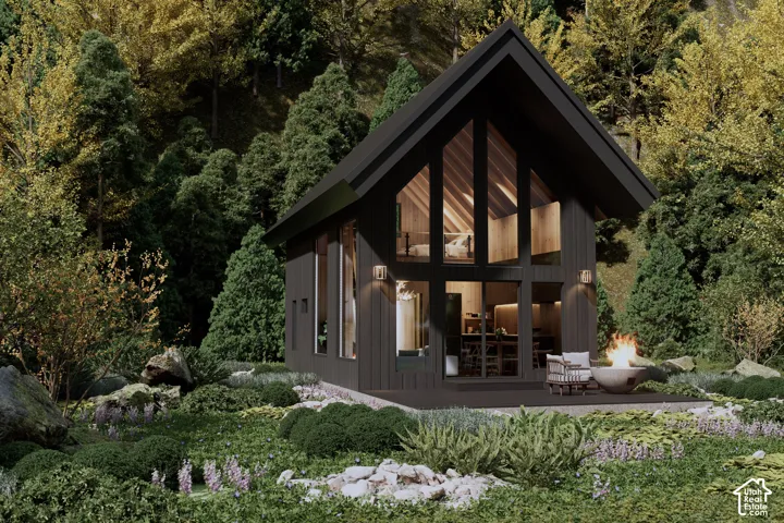 Striking modern A-frame cabin tucked among the trees, featuring dramatic glass, black Hardie board siding, and timeless mountain architecture.**Architectural rendering - finishes subject to completion.**