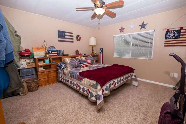 Bedroom featuring textured carpeting and neutral painted walls