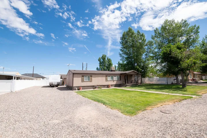 Expansive gravel driveway providing ample off-street parking