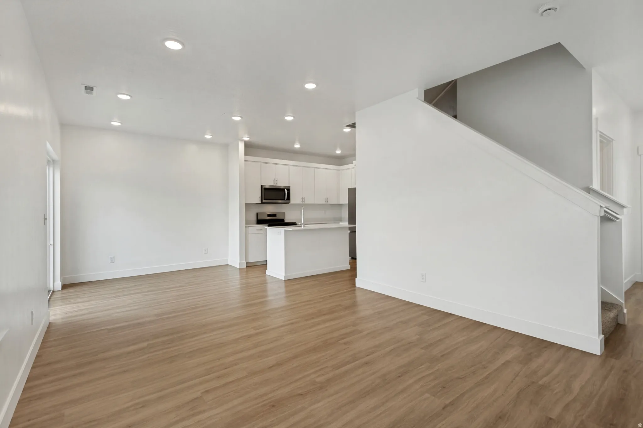Living room with recessed lighting and natural light