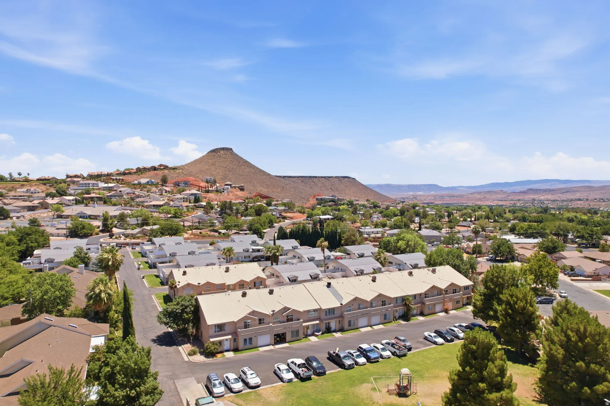 Aerial perspective showcasing a residential community with mature landscaping