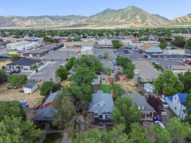 Townscape featuring extensive commercial development and mountain backdrop