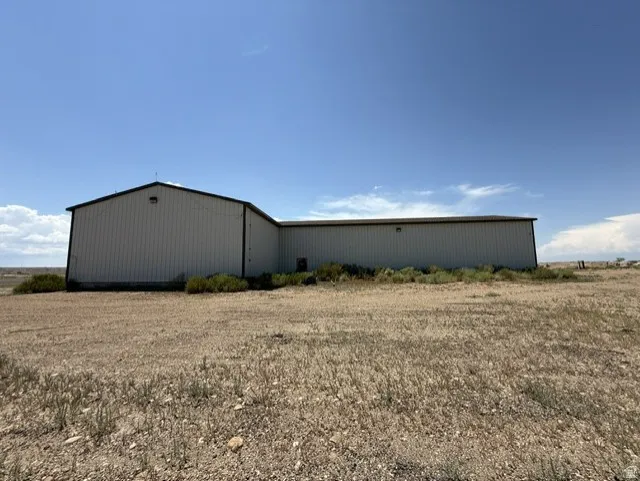 Metal-clad commercial building with a black-trimmed roof