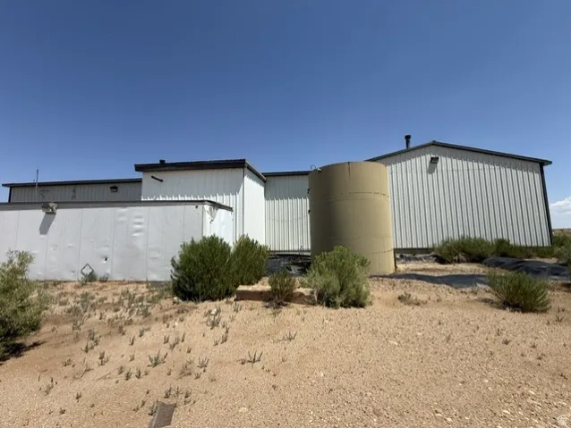 Industrial-style building featuring corrugated metal siding and a flat roofline