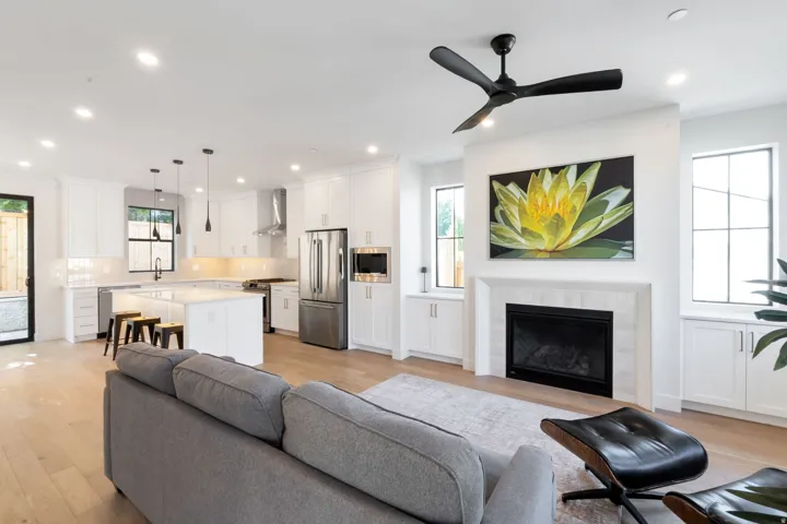 Open-concept living space with light wood-finish flooring