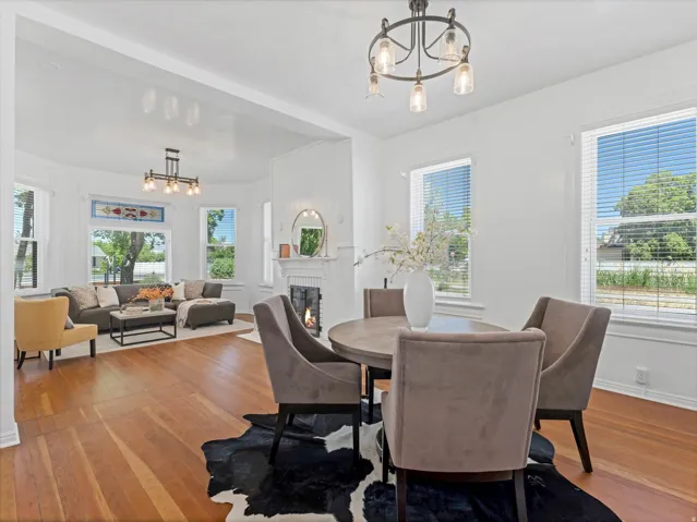 Hardwood flooring throughout the open-concept living and dining areas