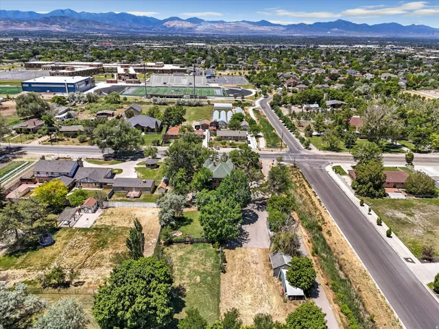 Aerial perspective of a developed neighborhood featuring residential properties and tree-lined streets