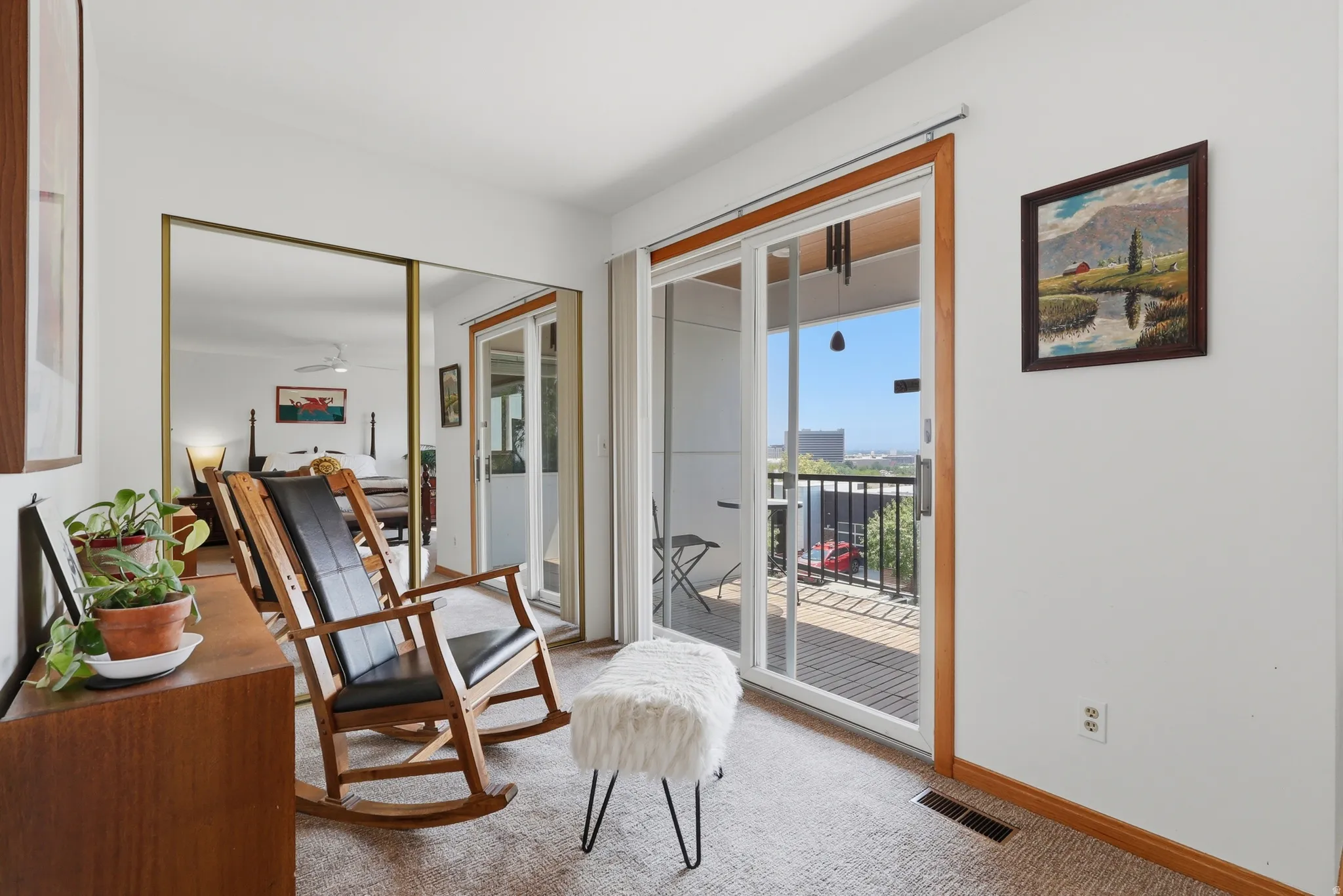 Light flex space adjoining the primary suite with large glass doors leading to a private deck with fabulous city/valley views!