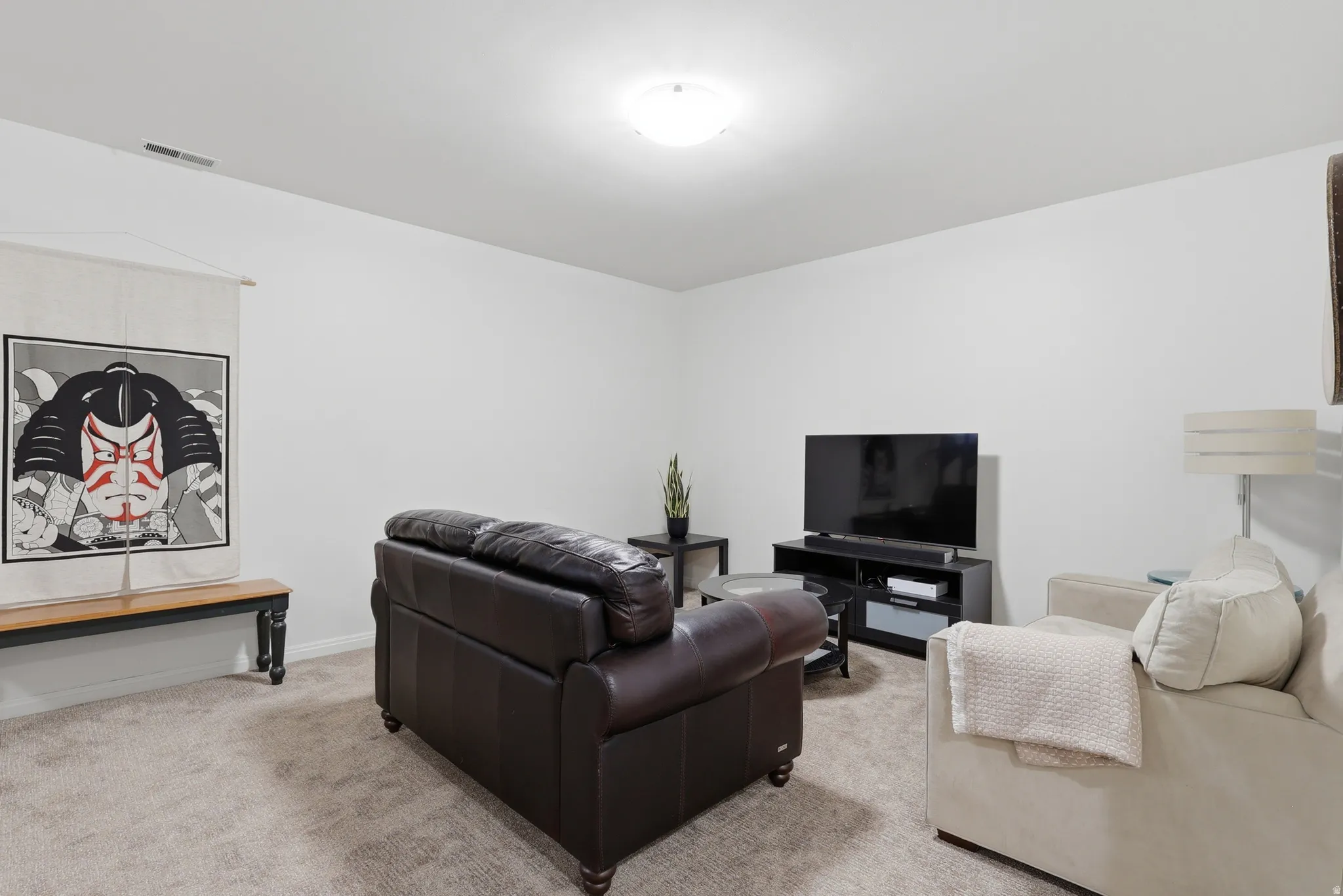 Spacious room featuring neutral carpeting, recessed lighting, and ample space