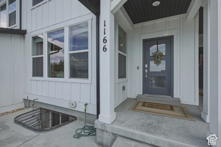 Modern board and batten exterior with a covered porch entry